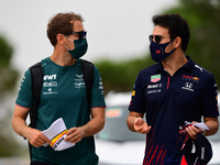 Sebastian Vettel of Aston Martin Cognizant F1 Team  and Sergio Perez of Red Bull Racing Honda  arrive before race of French GP in Paul Ricar...