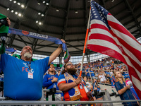FC Cincinnati fans hold up scarves during the Nation Anthem prior to the start of the MLS soccer match between FC Cincinnati and the Colorad...