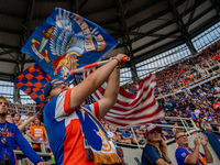 FCC fans wave flags during a MLS soccer match between FC Cincinnati and the Colorado Rapids that ended in a 2-0 Colorado win at TQL Stadium,...