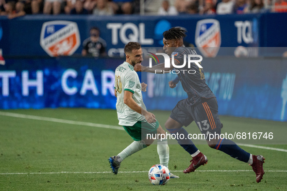 Cincinnati’s Joseph-Claude Gyau moves the ball upfield during a MLS soccer match between FC Cincinnati and the Colorado Rapids that ended in...