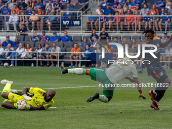 Colorado’s Michael Barrios falls to the ground after FCC goalie Kenneth Vermeer takes the ball from him during a MLS soccer match between FC...