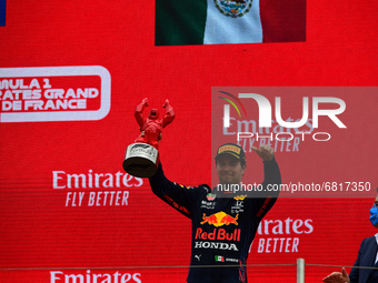Third placed Sergio Perez of Mexico and Red Bull Racing celebrates on the podium during the F1 Grand Prix of France at Circuit Paul Ricard o...