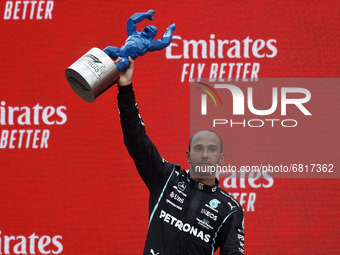 Lewis Hamilton of Great Britain and the (44) Mercedes AMG Petronas F1 Team lifts the trophy as runner up after the F1 Grand Prix of France a...