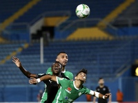 Raja players fight for the ball against a Pyramid's soccer player in action during CAF Confederation Cup Semi-final match between Pyramids f...