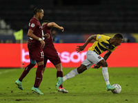Martines  player from Venezuela disputes a bid with Estupinan Tenório player from Equador during a match at the Engenhão stadium for the Cop...