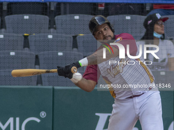 Arvincent Perez #9 of Venezuela team hits during the exhibition match  between the Venezuela  and the Mexico at Alfredo Harp Helu Stadium on...