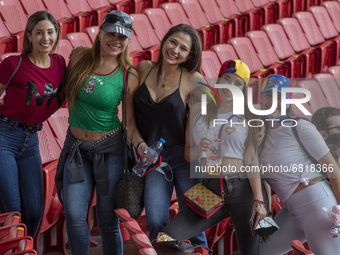 Baseball Fans attend at  Baseball exhibition match  between the Venezuela  and the Mexico at Alfredo Harp Helu Stadium on June 20, 2021 in M...
