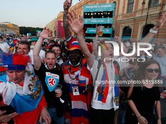 Russian supporters watch a live stream during the UEFA Euro 2020 Championship match between Denmark and Russia on June 21, 2021 at Fan Zone...