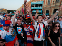 Russian supporters watch a live stream during the UEFA Euro 2020 Championship match between Denmark and Russia on June 21, 2021 at Fan Zone...