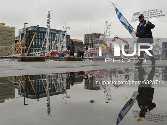 A fishermen seen at trhe end of the protest to increase the share of fishing quotas in Irish waters, while a huge fleet of fishing boats moo...