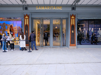 People attend La Samaritaine reopens its doors in Paris, France, on June 23, 2021. After sixteen years of renovation work, the department st...