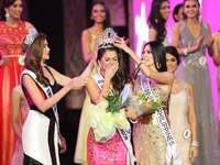 Quezon City, Philippines - Mary Jean Lastimosa (C) cries while being crowned Binibining Pilipinas Universe by 2013 Miss Universe Gabriela Is...