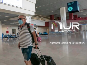 Passengers with face masks as seen at Chania International Airport CHQ in the Greek island of Crete. Crete is a popular travel destination w...