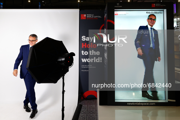  A congress attendant watching an hologram of himself,  during the third day of Mobile World Congress (MWC) Barcelona, on June 30,2021 in Ba...