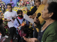 Enriqueta Romero, guardian of the Santa Muerte temple in Tepito, Mexico City, Mexico, on July 1, 2021, performs a rosary in memory of her hu...