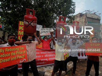 Activist of the CPI (Communist Party of India) hold placards and shouted anti government slogans against the Fuel and Gas price hike on way...