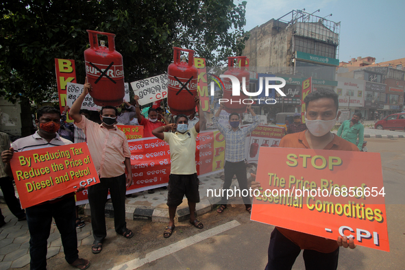 Activist of the CPI (Communist Party of India) hold placards and shouted anti government slogans against the Fuel and Gas price hike on way...