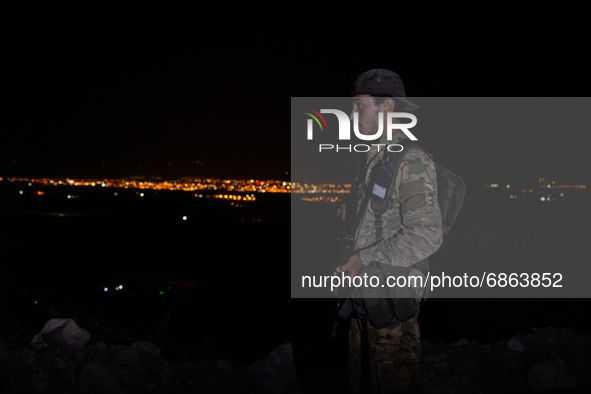 Fighters belonging to the Syrian National Army patrol near the Syrian-Turkish border near the town of Jindires in the countryside of Afrin,...