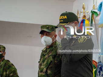 General of Colombia's police Jorge Luis vargas accomodates his face mask as Colombia's high branch military and police generals, Major Gener...