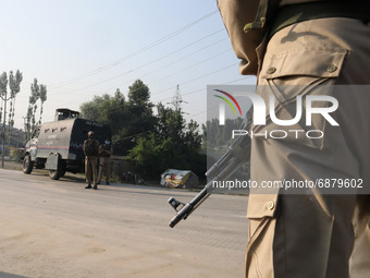 Indian police forces stand on a deserted road during a military operation in Srinagar, Indian Administered Kashmir on 16 July 2021. Two mili...