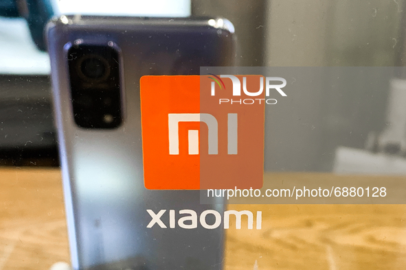 Xiaomi logo is seen in the store in Krakow, Poland on July 16, 2021. Xiaomi overtakes Apple in the global smartphone sales. 