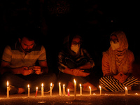Journalists and students light candles and pay tribute to Reuters photographer Danish Siddiqui in New Delhi, India on July 17, 2021. The Pul...