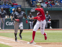 Dwight Smith #25 of the Monclova Acereros   runs to second base after hitting during   the match between Diablos Rojos and Monclova Acereros...