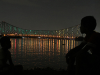 Kolkata's iconic Howrah Bridge  illuminated Olympic colours to boost up the morale of the Indian contingent participating in the upcoming To...