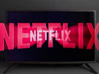 Netflix logo displayed on a tv screen is seen in this illustration photo taken in Krakow, Poland on July 19, 2021. (