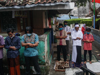 Indonesian muslims wearing protective mask as they attend the Eid Al Adha prayer during the COVID-19 emergency restrictions on 20, July 2021...