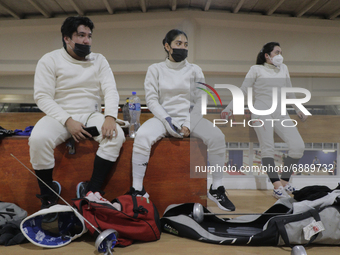 Fencers watch fellow mexican fencer and athlete Mariana Arceo train during her final training sessions at the Benito Juarez Gymnasium in Mex...