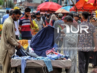 People purchase goods ahead of Muslim festival Eid-Ul-Adha in Sopore town of District Baramulla Jammu and Kashmir India on 20 July 2021. (