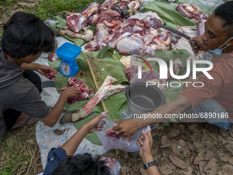 Workers pack sacrificial beef before it is distributed to the poor in Pombewe Village, Sigi Regency, Central Sulawesi Province, Indonesia on...