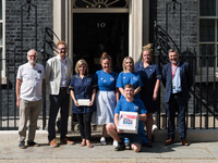 LONDON, UNITED KINGDOM - JULY 20, 2021: Jeremy Corbyn MP (1L) and Ian Byrne MP (1R) together with NHS staff deliver a petition with 800,000...