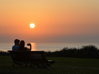 Couple watching the sunset near Arromanches.
On Wednesday, July 20, 2021, in Arromanches, Calvados, Normandy, France. (