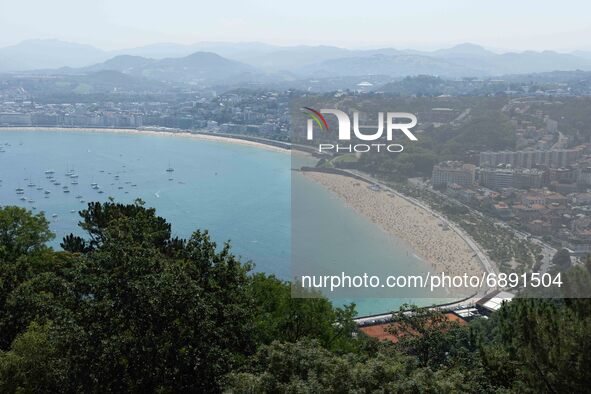 Panoramic view of San Sebastian, with the beaches of Ondarreta and La Concha crowded of people, on July 20, 2021. Beachgoers have gathered a...