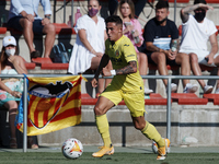 Jeremy Pino of Villarreal runs with the ball during the Pre-Season friendly match between Valencia CF and Villarreal CF at Oliva Nova Beach...
