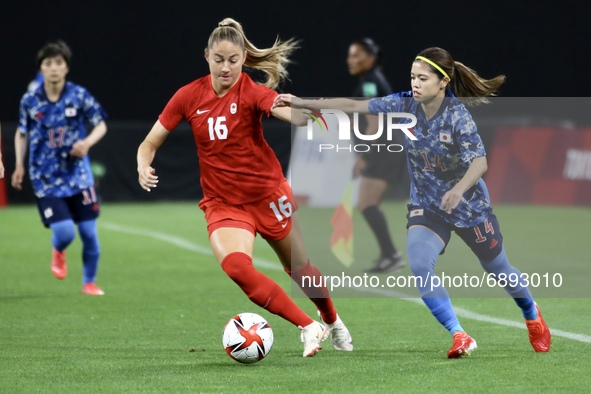 (14)HASEGAWA Yui of Team Japan battles for possession with (16)BECKIE Janine of Team Canada during the Women's First Round Group E match bet...