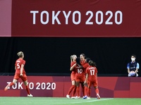 (12)SINCLAIR Christine of Team Canada celebrates with teammates after scoring their side's first goal during the Women's First Round Group E...
