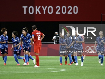 Japan team celebrates after scoring their side's first goal during the Women's First Round Group E match between Japan and Canada during the...