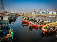 A number of fishing boats rest on a fishing village in Tambaklorok, Semarang, Central Java Province, Indonesia on July 21, 2021. (