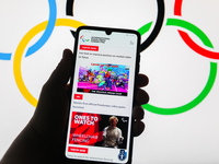 Tokyo 2020 Paralympic Games official website is displayed on a mobile phone screen photographed with Olympic Rings symbol background for ill...