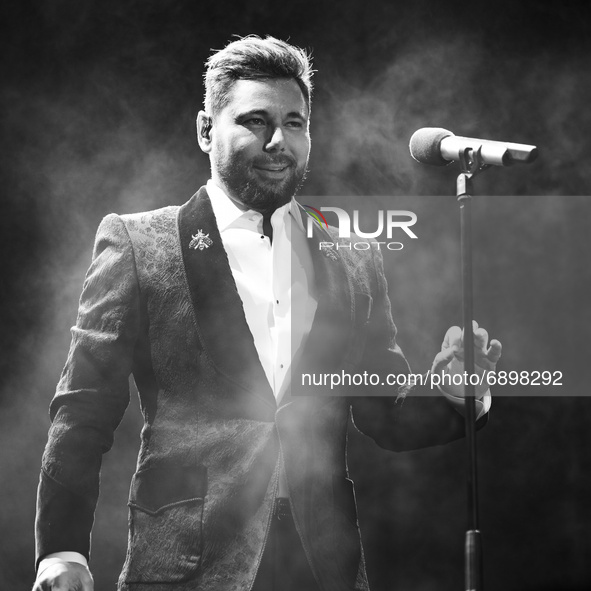 (EDITOR'S NOTE: Image was converted to black and white) Singer Miguel Poveda performs during music festival at Palacio in Real Madrid, Spain...