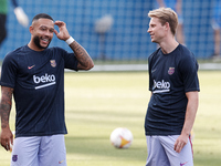 (L-R) Memphis Depay and Frenkie de Jong of Barcelona during the warm-up before the pre-season friendly match between FC Barcelona and Girona...