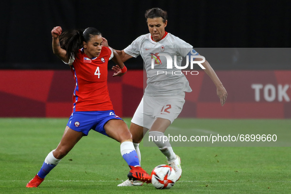(12) Christine SINCLAIR of Team Canada battles for possession with (4) Francisca LARA of Team Chile during the Women's First Round Group E m...