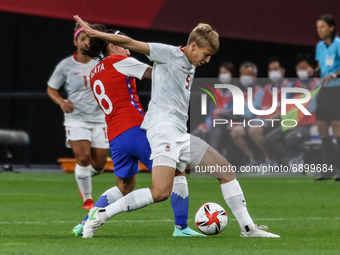 (5) QUINN of Team Canada battles for possession with (8) Karen ARAYA of Team Chile during the Women's First Round Group E match between Chil...