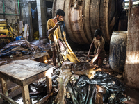 Tannery workers process rawhide that has been collected by sacrificed cattle on Eid Al Adha as part of preservation in Savar tannery industr...
