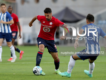 Benjamin Andre of Lille OSC (L) vies with Pepe of FC Porto during the pre-season friendly football match between FC Porto and Lille OSC at t...