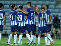 Fernando Andrade of FC Portocelebrates with teammates after scoring during the pre-season friendly football match between FC Porto and Lille...