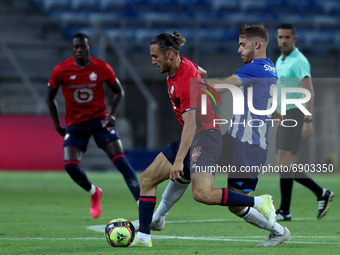 Yusuf Yazici of Lille OSC (L) vies with Toni Martinez of FC Porto during the pre-season friendly football match between FC Porto and Lille O...